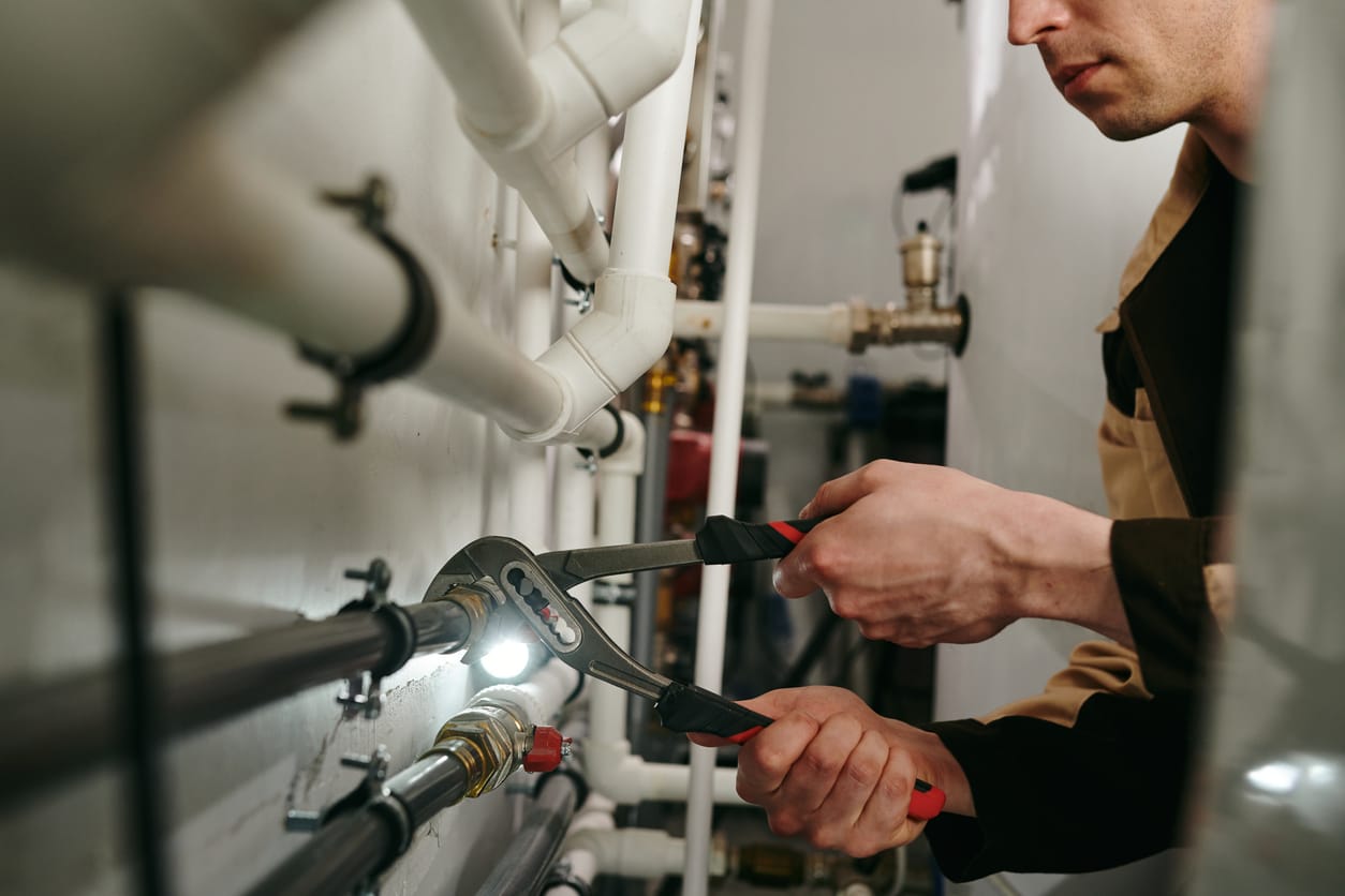 Plumbers maintaining commercial plumbing pipes in Chambersburg
