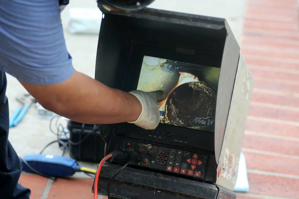 Technician viewing a drain inspection camera in Chambersburg